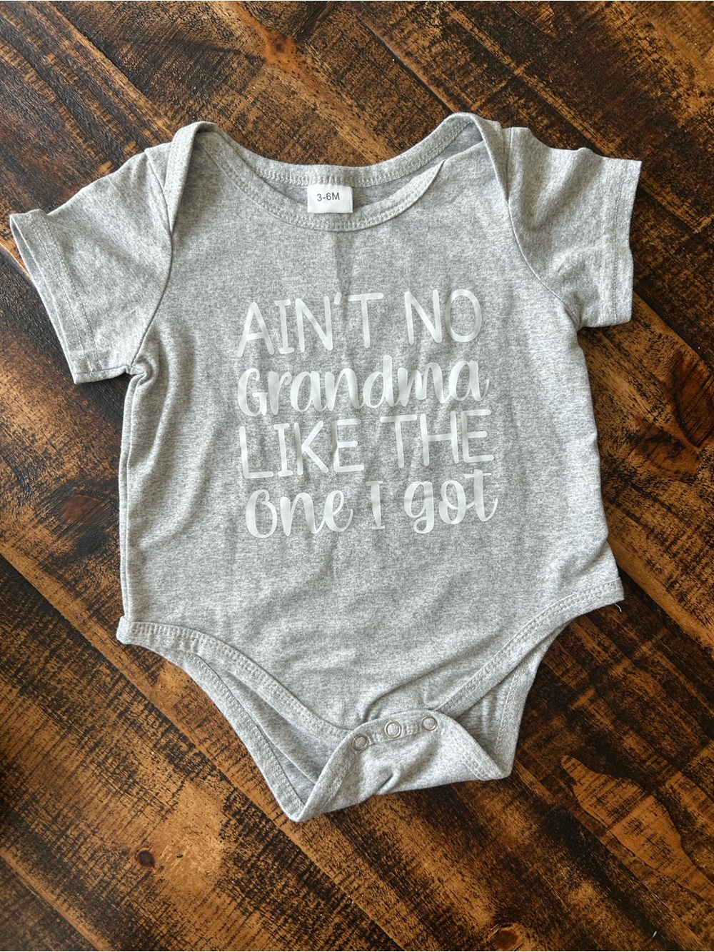 Gray Baby One-Piece Bodysuit with Grandma Graphic